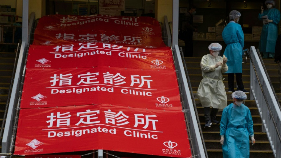 Virus-hit Hong Kong invokes emergency powers to allow in China medics