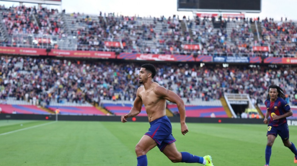 Barca claim Liga lead after Araujo's late derby winner
