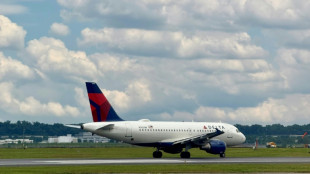 Delta offers upbeat outlook on travel demand, lifting shares