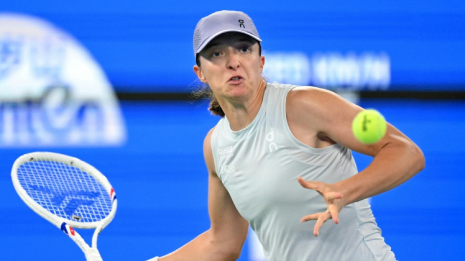 Swiatek coasts through Wuhan debut while heat wilts players