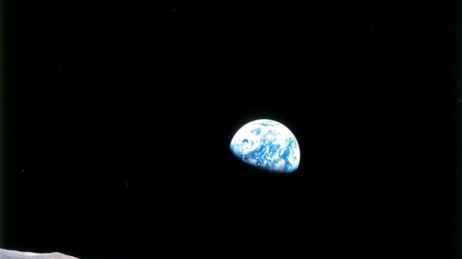 Artemis II crew basks in glow of lunar flyby en route to Earth