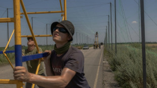 Ukraine covers frontline roads with anti-drone nets