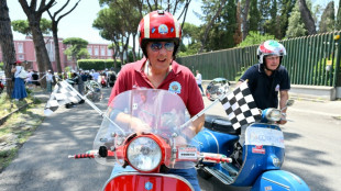 Thousands ride through Rome as Vespa celebrates 80 years