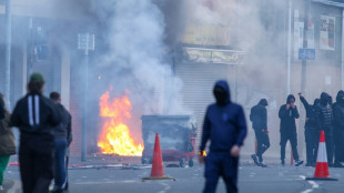 Protesters torch building and vehicles, block roads over Belfast stabbing