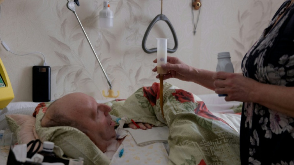 Sans &eacute;lectricit&eacute;, la lutte d'une Ukrainienne au chevet de son mari malade
