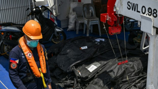Philippine rescuers pull more victims from charred ferry