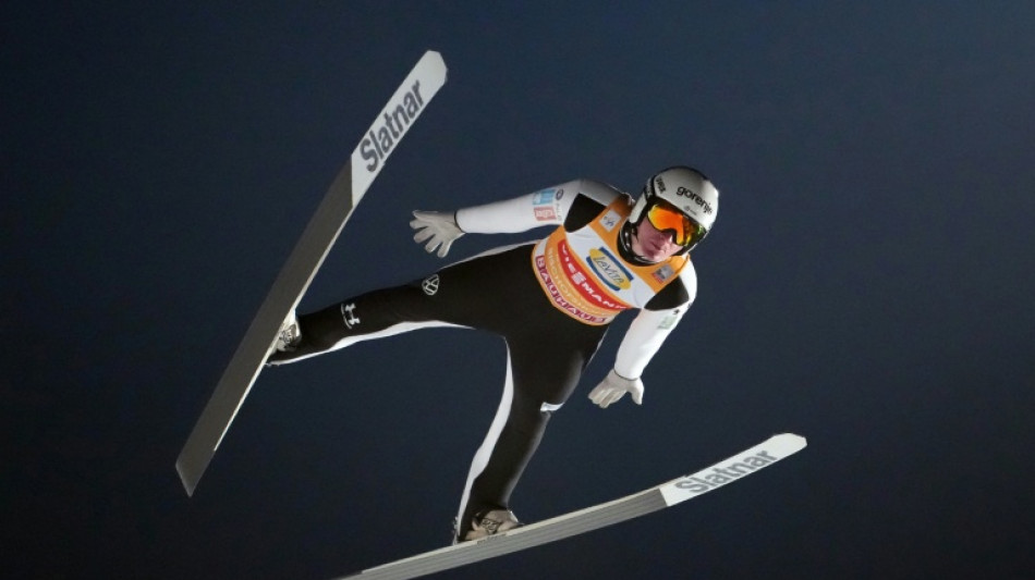Domen Prevc secures Four Hills ski jump title to emulate brother