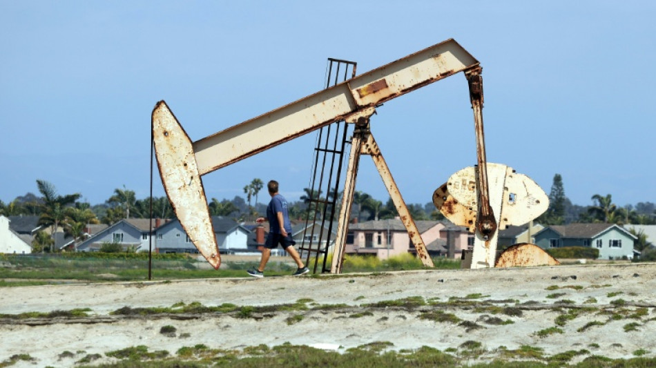 Oil gains on fresh attacks, dollar slides as inflation slows