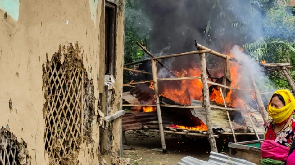 Women burn down houses of two accused over India naked women video