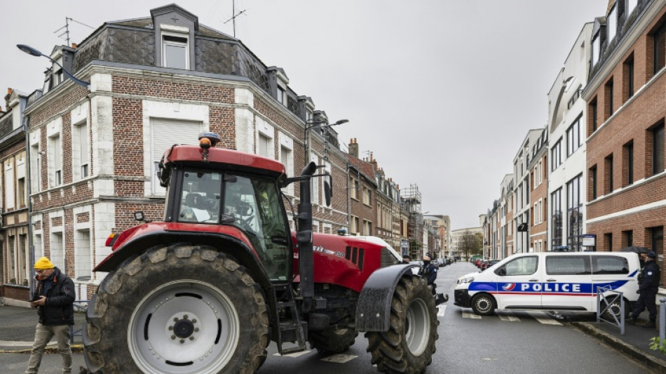 Macron meets French farmers in bid to defuse anger over trade deal